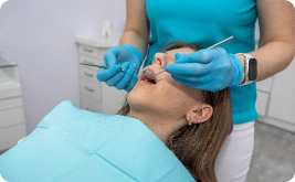 Women in dentist chair getting teeth checked